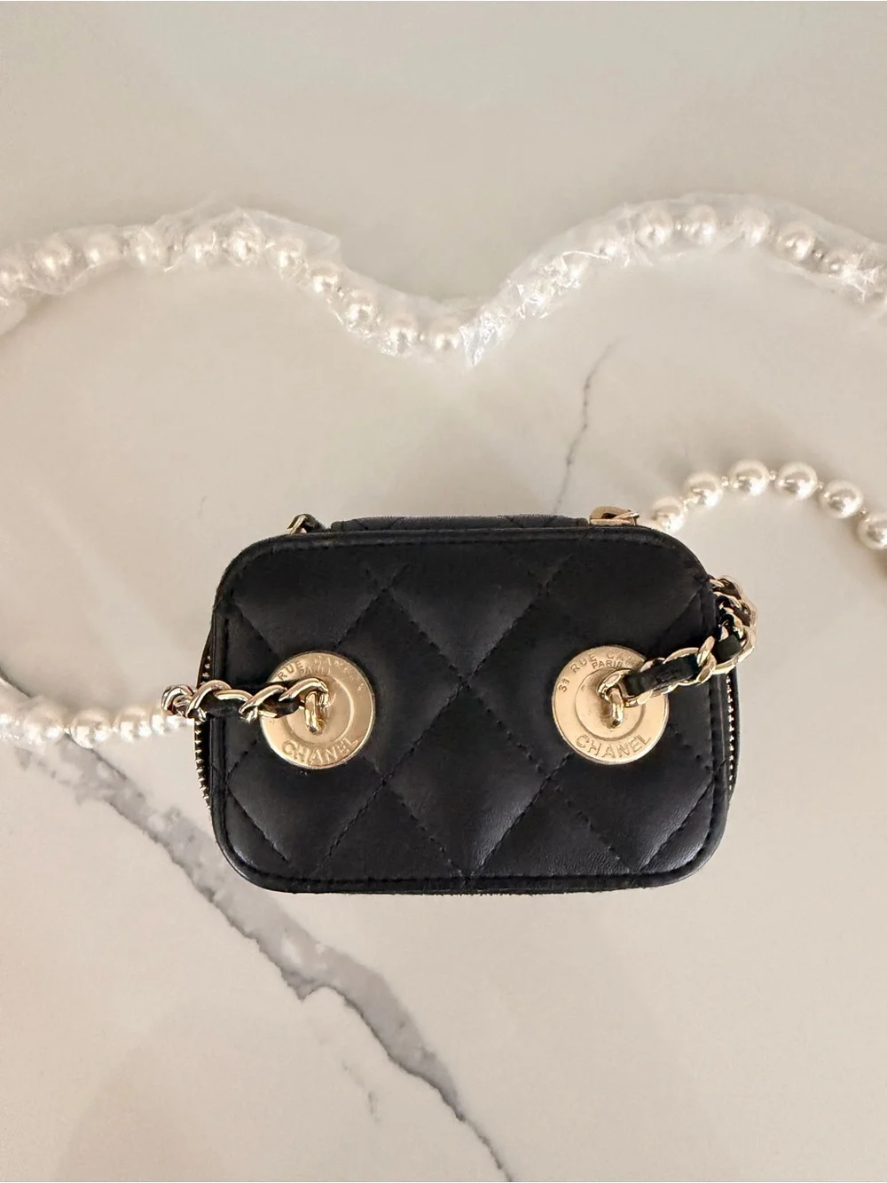 CHANEL Black Quilted Vanity Mini Bag with Pearl Strap